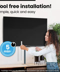 Person installing TV Cord Hider Kit 34 Inch White Peel And Stick Cable Concealer For Wall Mounted TVs And Desks 2 Pack