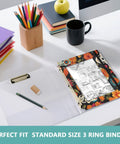 Zippered Gothic Skull Design Coupon Organizer for 3 Ring Binders on desk with pencils and coffee mug