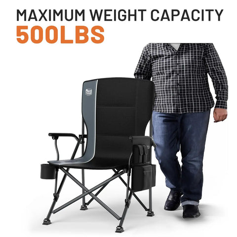 Oversized Folding Camping Chair With High Back Support 500 Lbs Capacity next to person, highlighting sturdiness and size