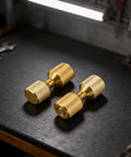 Gold finish Pipe Fitter Flange Alignment Pin Set 1-1/8 Inch Two-Hole Dowel Pins on workbench