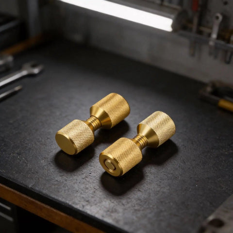 Gold finish Pipe Fitter Flange Alignment Pin Set 1-1/8 Inch Two-Hole Dowel Pins on workbench