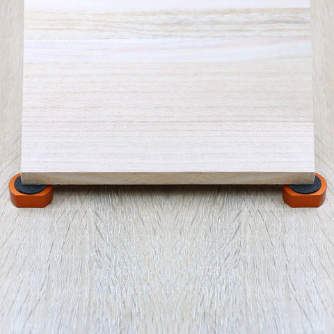 Wooden board supported by Beefy Heavy Duty Aluminum Bench Dogs 8 Pack for MFT Workbench And Woodworking Projects Non Slip Bench Dog Clamps.