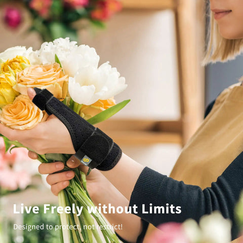 Person wearing Thumb Spica Splint For Arthritis Pain Relief And Support Fits Left Or Right Hand holding flowers