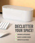 White Cable Management Box For Power Strips Up To 10.5 Inches on desk next to keyboard, focuses on decluttering space.