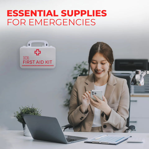 Front view of a white wall-mounted plastic first aid kit with a red cross and FIRST AID KIT label.