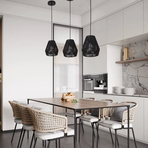 7 Inch Woven Rattan Pendant Light Black Boho Basket Fixture For Farmhouse Kitchen Island, Bedroom, And Living Room Modern Hanging Lamp Set Of 3 With Hand Woven Natural Twine For A Cozy Vibe Glow over dining table in modern kitchen.