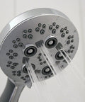 Close-up of Rio Multi-Function Handheld Shower Head with Hose, Polished Chrome Finish, showing 5 spray settings in action.