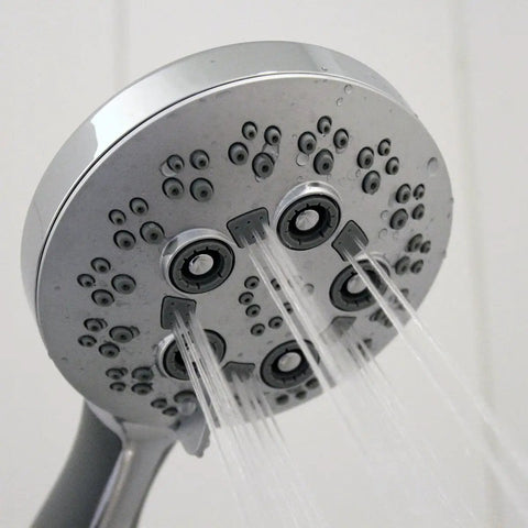 Close-up of Rio Multi-Function Handheld Shower Head with Hose, Polished Chrome Finish, showing 5 spray settings in action.