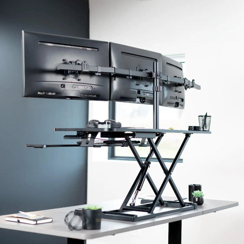 Height Adjustable 48 Inch Standing Desk Converter With Triple Monitor Mount for 21.5 to 27 Inch Screens in sleek Black