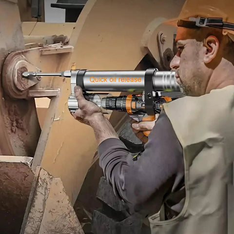 Worker using Grease Gun Adapter For Cordless Drills And Impact Drivers Turns Pneumatic Tools Into Electric Grease Guns