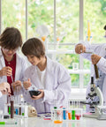 Students using Graduated Dropper Pipettes Kit 3 Pack 0.5ml 1ml 5ml Borosilicate Glass in a chemistry education setting