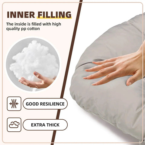 Hand pressing plush surface of outdoor egg chair cushion with innerspring resilience and thick padding, showing durability.