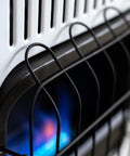 Close-up of a 30,000 BTU Vent Free Blue Flame Propane Heater with battery ignition, showing blue flame and protective grill