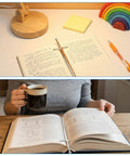 Vintage Sword Style Letter Opener For Envelopes And Mail placed on open notebooks and books with a cup on a desk.
