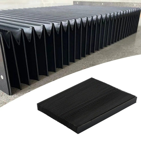 Heavy Duty CNC Accordion Guard Bellows Cover, Stretchable Rubber PVC Shield for Milling Machines on a worksite surface.