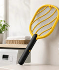 Next Level Handheld Bug Zapper Racket With Batteries Included, Safe Three Layer Mesh, in a kitchen setting.