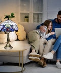 Tiffany Style Blue Stained Glass Table Lamp with family in living room, adds warm ambience, 12x12x19 inches, includes 2 LED bulbs