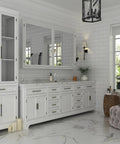 White bathroom with 10 Pack 3 Inch Black And Gold Cabinet Handles Square Drawer Pulls installed on cabinets, elegant modern decor.