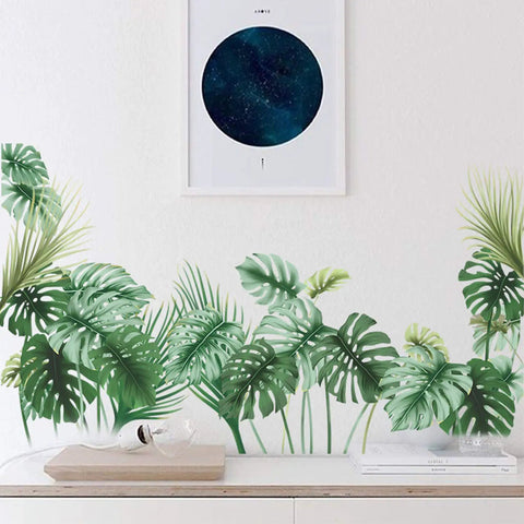 Palm Leaf Wall Decals Set For Living Room And Bedroom Tropical Green Plant Wall Stickers on a white wall, creating a lush oasis.