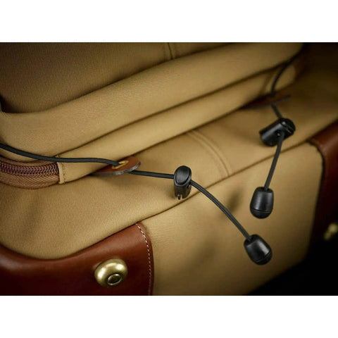 Close-up of Rucksack 25 Camera Bag For DSLR Gear With Tablet Pocket, showcasing drawstring closure and chocolate leather trim.