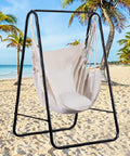 Boho Macrame Hammock Chair Hanging Rope Ceiling Swing For Indoor And Outdoor Use, cozy beach setting, supports up to 330 lbs