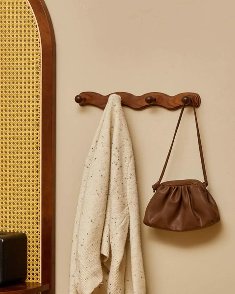 Walnut Wood Coat Rack Wall Mount Set Of 4 Heavy Duty Hooks with robe and bag hanging, modern rustic wall hanger for entryway.