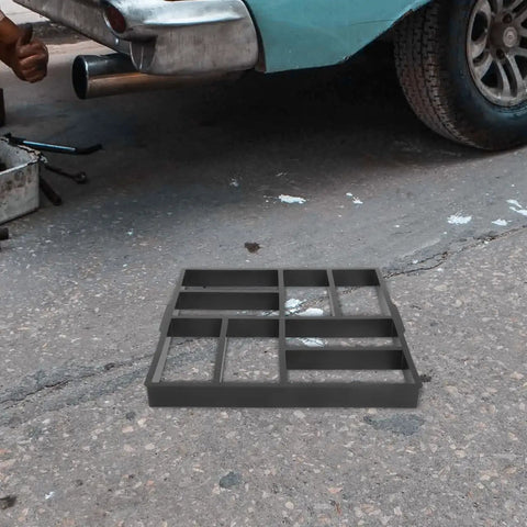 Plastic Path Maker Mold For Concrete Pavers 16.45 Inch shown on asphalt near car, ideal for DIY garden path installation.