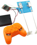 2.4G 4-Channel RC Boat Model Kit with controller, motors, and propellers ready for assembly.