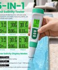 5 In 1 Digital Salt Tester And PH Meter For Saltwater Pools with smiley face graphics, testing water quality at pool edge.
