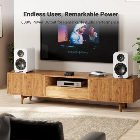 Living room setup with speakers and TV, showcasing Beefy 2 Channel Class D Desktop Amplifier Powered By TPA3255 With 600W Total Power.