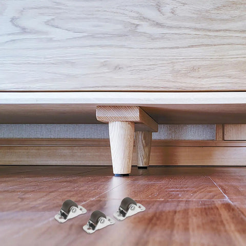 Eight Pack Heavy Duty Silent Rubber Replacement Casters With Mounting Screws For Rolling Cart Furniture Drawers Cabinets And Workbenches Top Shelf Build For Zero Hassle Gliding under a wooden cabinet.