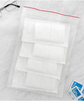 Red Line 9x12 Inch Zipper Reclosable Bags, 4 Mil Clear Poly Bags Food Safe, Easy Seal, Transparent Storage Bags Pack of 200 for Organization and Kitchen Use, shown with stacked bags