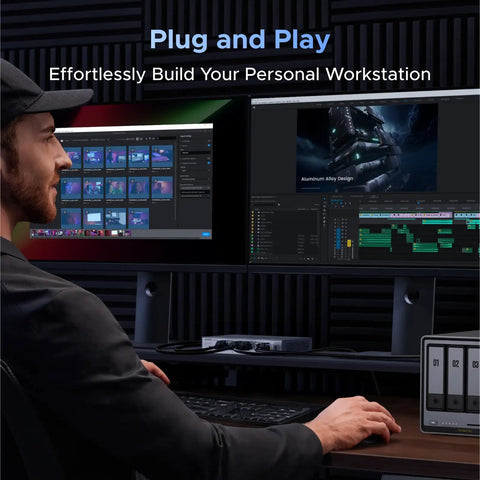 Man using Six Port 2.5Gb Ethernet Switch With Five 2.5Gb Ports And One 10Gb SFP Plus Port at workstation, dual monitors displayed.