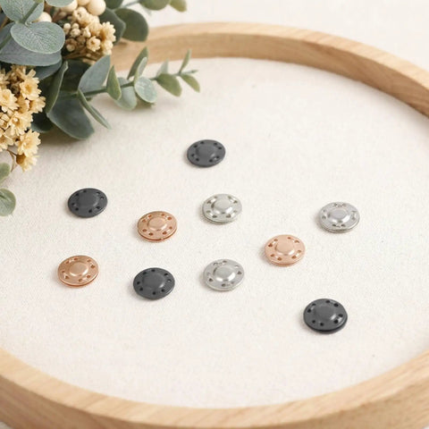12 Pairs Killer Hold Magnetic Snaps, No Sweat Easy Sew On Fasteners, Heavy Duty Metal Buttons For Bags displayed in assorted colors.