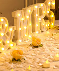 Mr And Mrs LED Light Up Sign 8.4 Inch With 12 Flameless Candles and 300 Artificial Rose Petals on wedding table