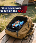 Hyper Go H16MT 1/16 4x4 Brushless RC Truck with Updated ESC inside a backpack on a wooden table outdoors