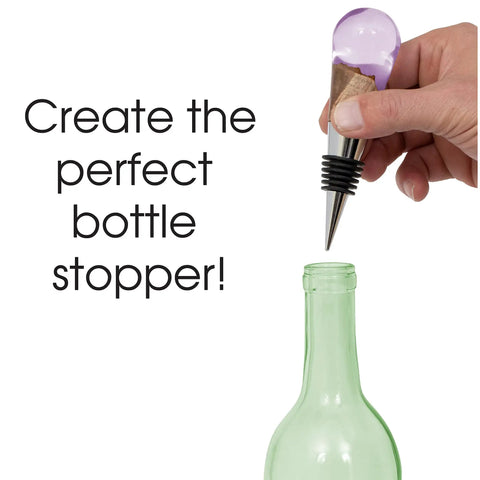 Hand placing stopper from DIY Bottle Turning Kit With Five Classic Chrome Stoppers, 19/64 Drill Bit, 1 Inch 8 TPI Chuck, Ratcheting T Handle, And 3/8 Inch Tap For Wood, Acrylic Or Resin Turning into bottle