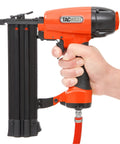 Real Deal Air Brad Nailer With Quick Release Bottom Load Magazine And 1000 18G Type 180 Brads To Knock Out Woodworking Projects In Bold Orange Carry Case handheld view with black and orange design