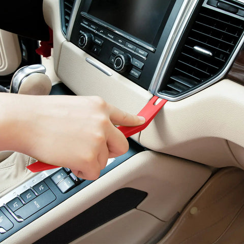 Snag These Dope 5 Piece Nylon Auto Trim Removal Tools For Your Ride Features No Damage Pry Sets For Car Door Panels Dashboards And Clip Fastener Pullers Easy Garage Gear, red nylon trim tool in use on car dashboard.