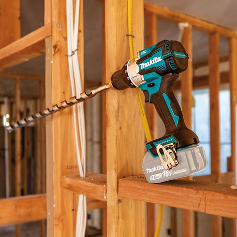 18V LXT Brushless Compact Hammer Drill Driver One Half Inch Cordless Tool Only, 970 Inch Pounds Max Torque, Longer Run Time Per Charge, Built For Pros And DIYers, drilling into wood frame in construction site