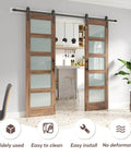 Installed Double 24 By 84 Inch Glass Barn Doors With 48 Inch Width Eight Foot Hardware Kit And Handle Included Five Panel Frosted Glass LVL Wood Panel Waterproof PVC Surface Pre Drilled Holes Easy Assembly in a modern interior setting.