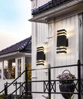 2 Pack LED Dusk To Dawn Outdoor Lights With Aluminum Sensor Waterproof Exterior Fixtures installed on a home's entryway.