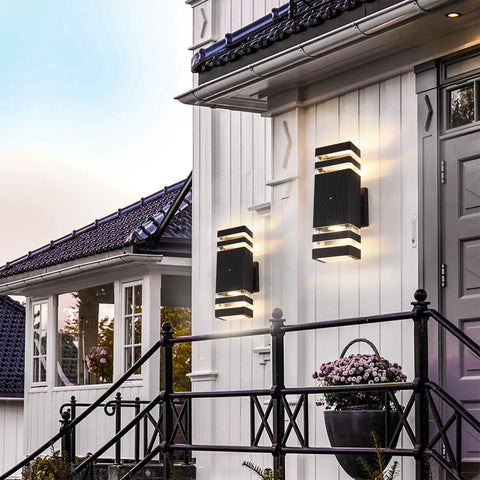 2 Pack LED Dusk To Dawn Outdoor Lights With Aluminum Sensor Waterproof Exterior Fixtures installed on a home's entryway.