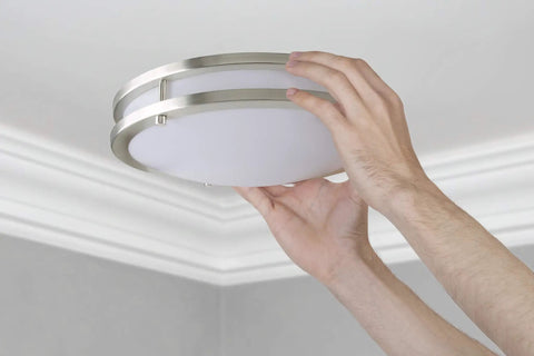 Hands installing Bright As Day LED Flush Mount Ceiling Light 10 Inch Dimmable 1350lm 5000K Daylight Brushed Nickel Round Fixture