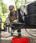 Man setting up Weight Distribution Hitch With Tension Chain System For Easy Hitching And Anti Bounce Sway Control, 2 Inch Shank