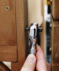 Prograde 1/4 Inch Stubby Ratchet Wrench Dual Socket Bit Driver 72 Tooth Chrome Alloy being used on a screw in wood.