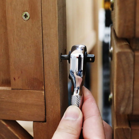 Prograde 1/4 Inch Stubby Ratchet Wrench Dual Socket Bit Driver 72 Tooth Chrome Alloy being used on a screw in wood.