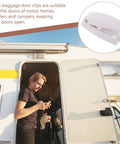 Must-Have White Stainless Steel And Abs Baggage Door Catch Clip For Rv Trailer Camper securing an RV door while a person checks their phone.