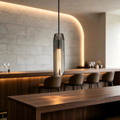 PRTSER 11.8" Modern Pendant Light Fixture with Smoke Gray Crystal Lampshade hangs over a wooden bar counter.