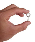 Hand holding a 1-inch nickel-plated screw eye from the One Inch Screw Eye And Eye Hook Set Nickel Plated For Lightweight DIY Projects.